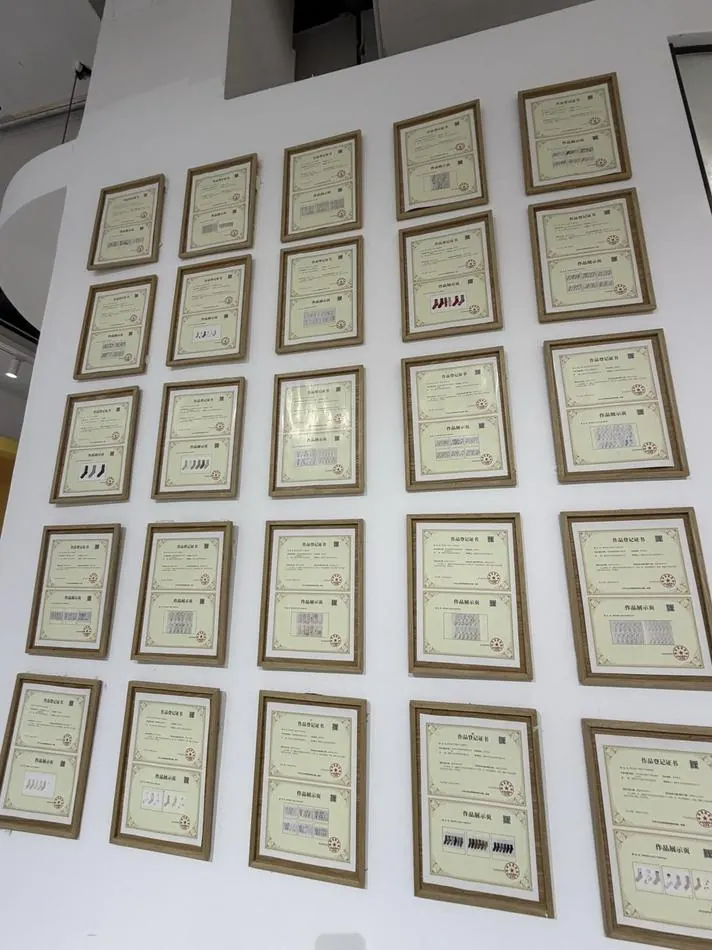 A wall of framed design-copyright registrations