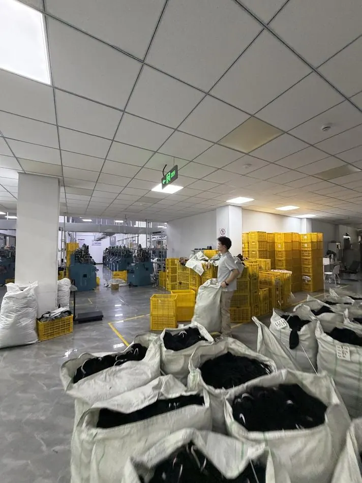 The packing floor with crates and bulk bags of finished socks