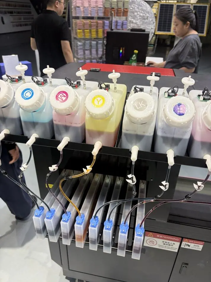 Ink tanks feeding a digital sock printer